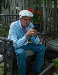 Lowell Davis enjoys his pipe while we eat popsicles he provided.